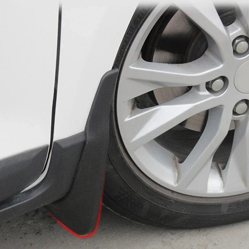 Professional matte black durable plastic mud guard installed behind a car wheel