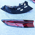 Sleek black and red aftermarket car tail light assembly with a glossy finish.