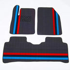 Dark grey custom car floor mats featuring distinctive red and blue racing stripes.