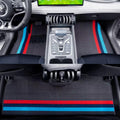 Black fabric car floor mats featuring distinctive red and blue racing stripes for BYD interior.