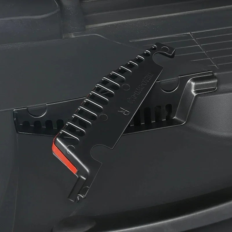 Black durable plastic car interior organizer clip with red accent detail.