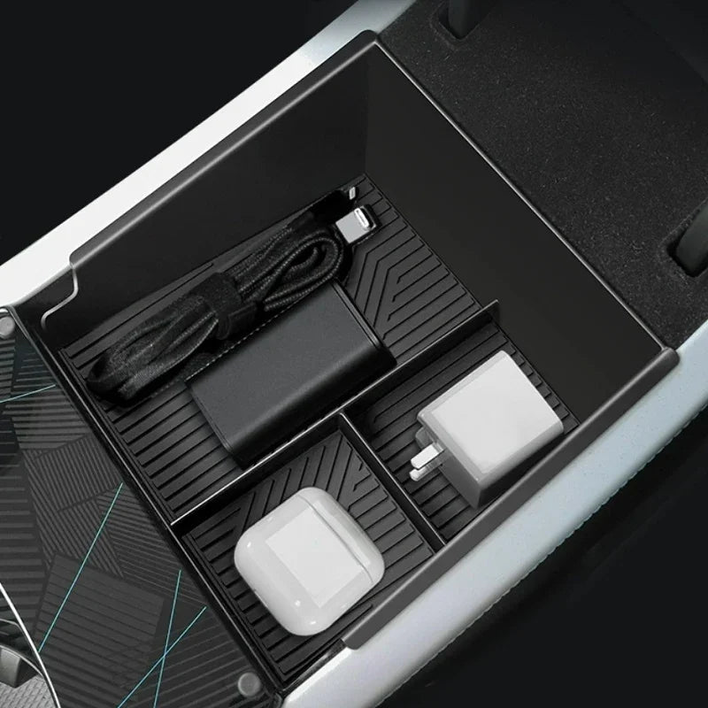 Black textured center console organizer tray for car holding chargers and cables