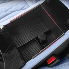 Black textured center console organizer tray with red trim for BYD vehicle interiors.