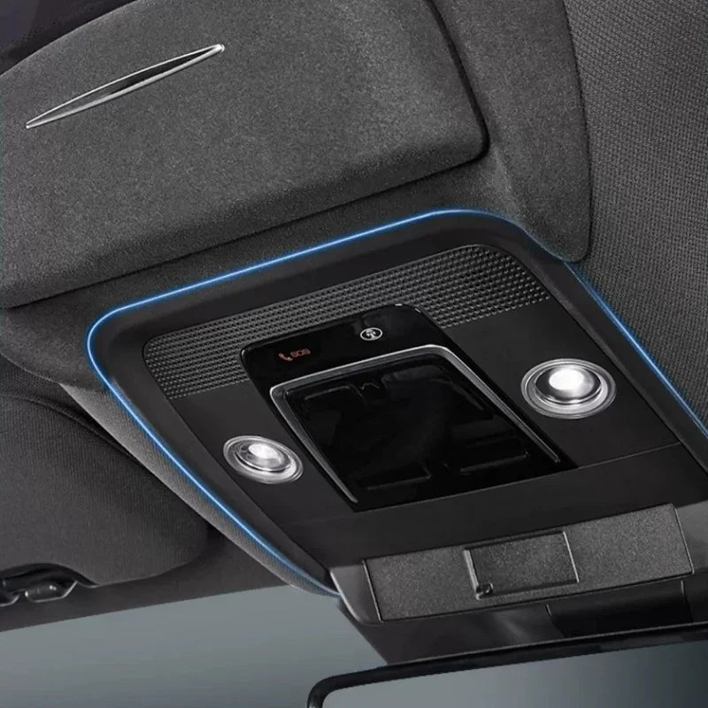 Black interior overhead console featuring integrated LED lights and blue ambient lighting trim.