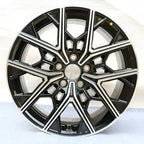 Black and silver dual-tone alloy car rim with a multi-spoke geometric design.