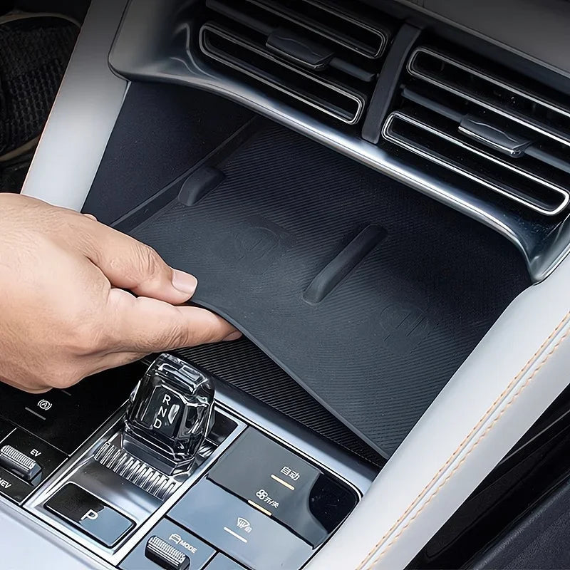 Black textured anti-slip center console mat for BYD interior protection.