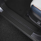 Black leather door sill protector for BYD car interior, durable and waterproof material.