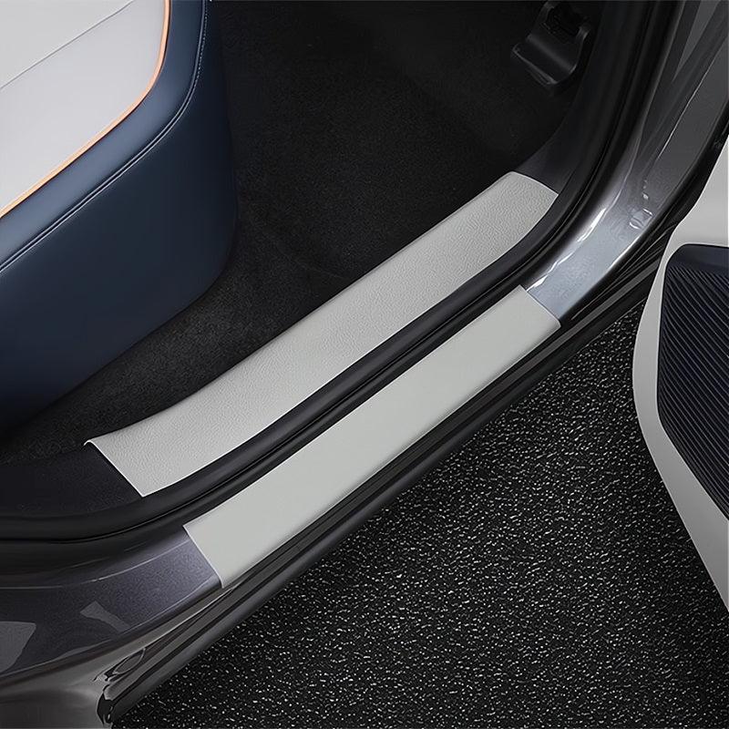 Grey leather door sill protector for BYD car interior, featuring a durable protective design.