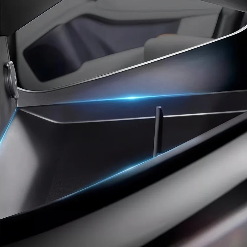 Close-up of a sleek grey car interior featuring an integrated blue ambient light strip.