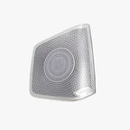 Silver metallic Dirac-tuned speaker grille with a radial perforated pattern.