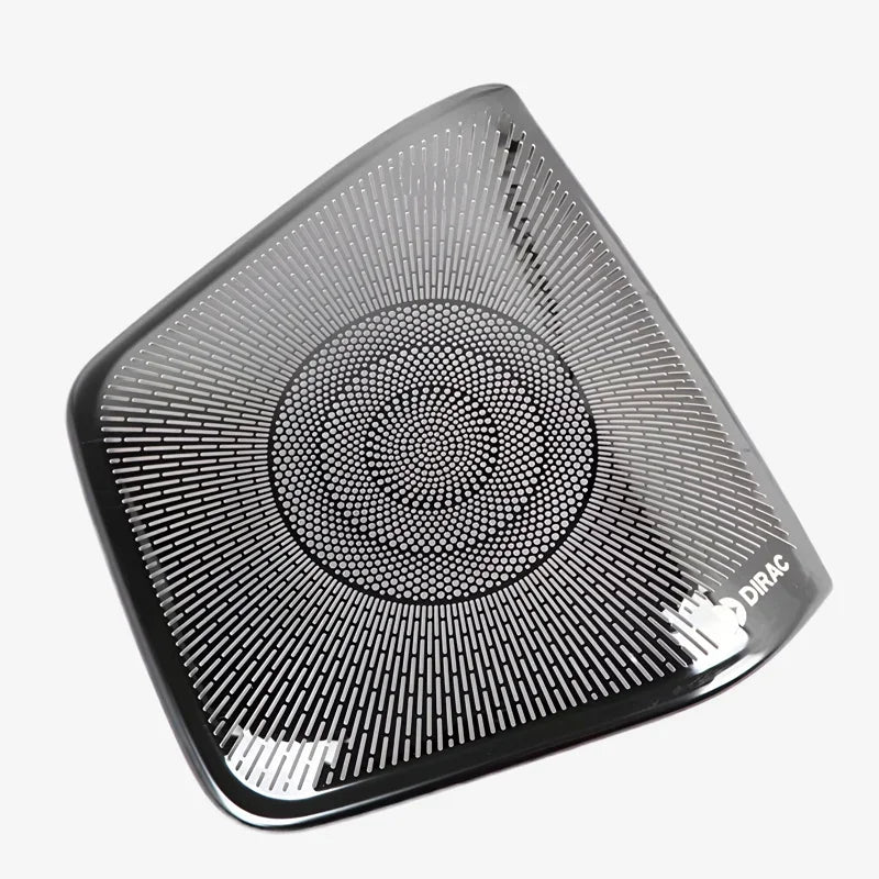 Black Dirac premium speaker grille with a sleek metallic texture and precision-cut radial pattern.