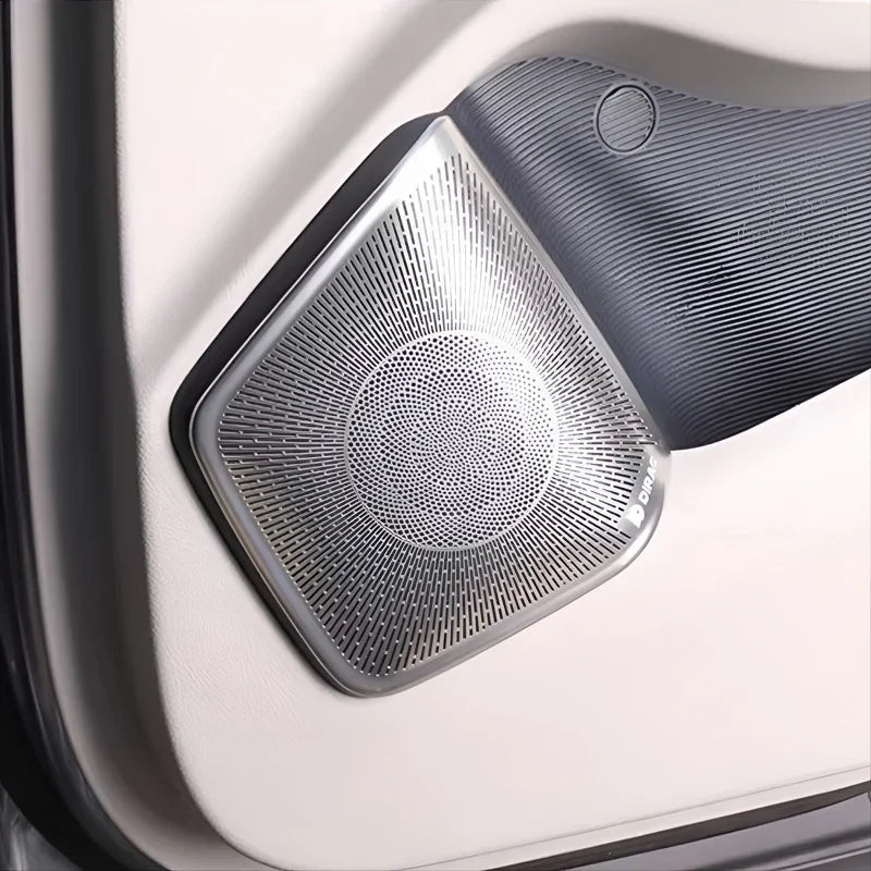 Silver metallic door handle cover with textured anti-scratch finish for BYD interior protection.