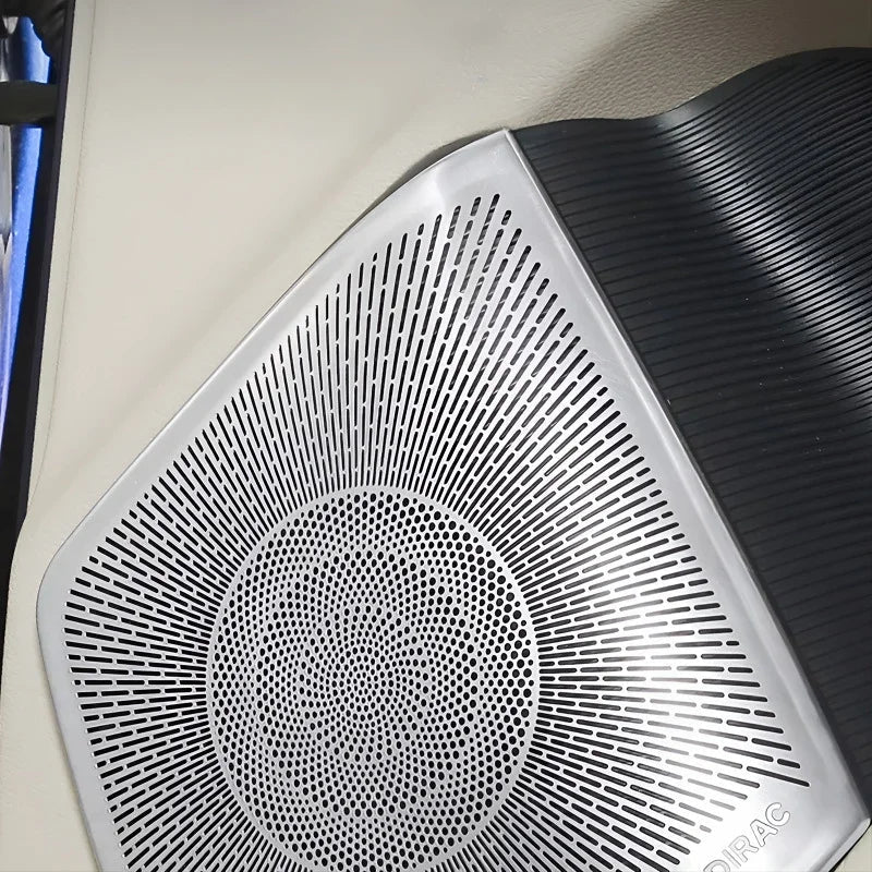 Silver metallic patterned speaker grille with a black textured surround for BYD interior.