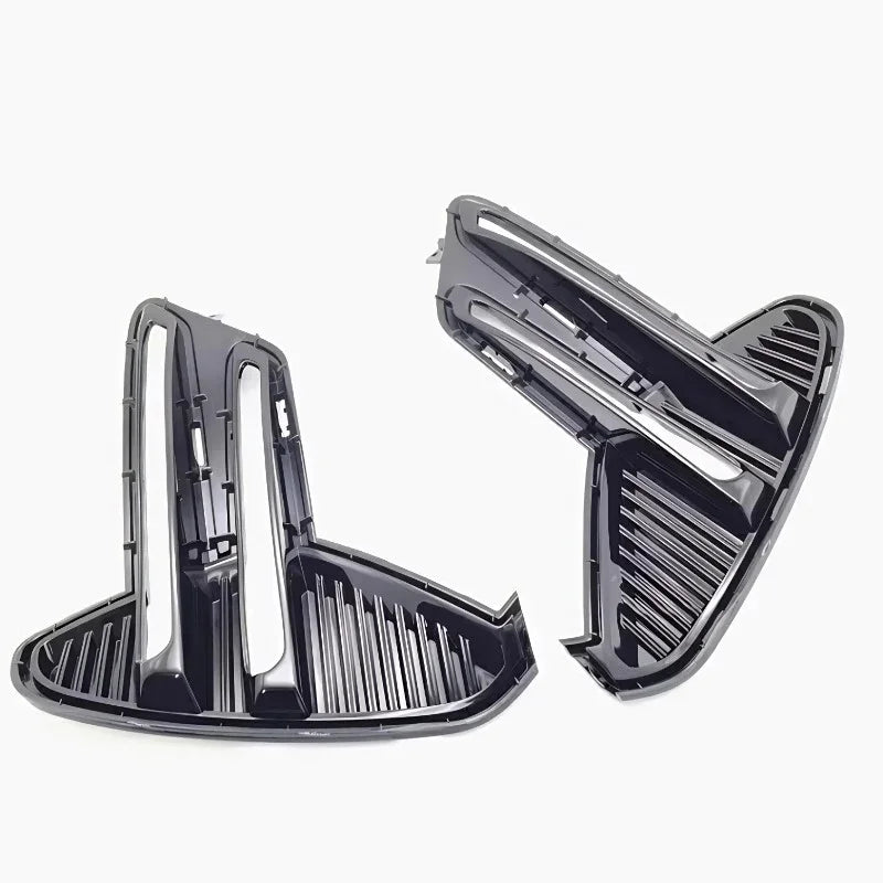 Black glossy aerodynamic car vent trim accessories with a sleek slatted design.