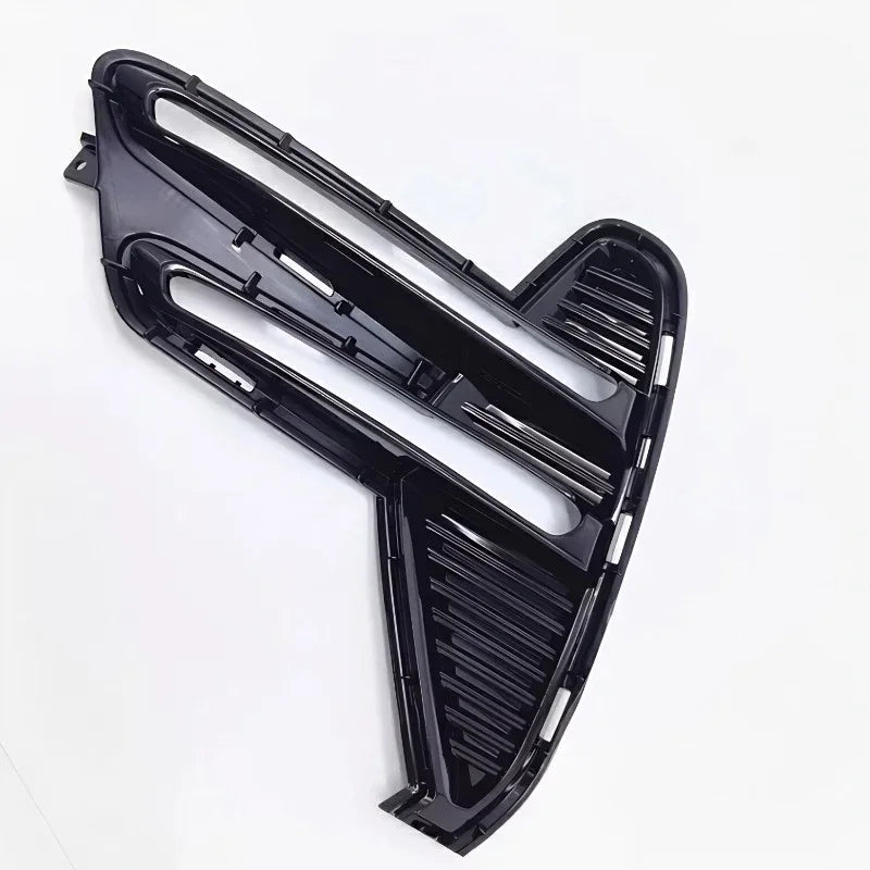 Glossy black aerodynamic car trim component made of durable high-quality plastic.