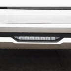 Sleek silver bumper with integrated LED daytime running light strip in a black housing.
