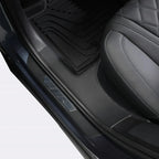 Black leather quilted car seat and durable black rubber floor mats for BYD protection.
