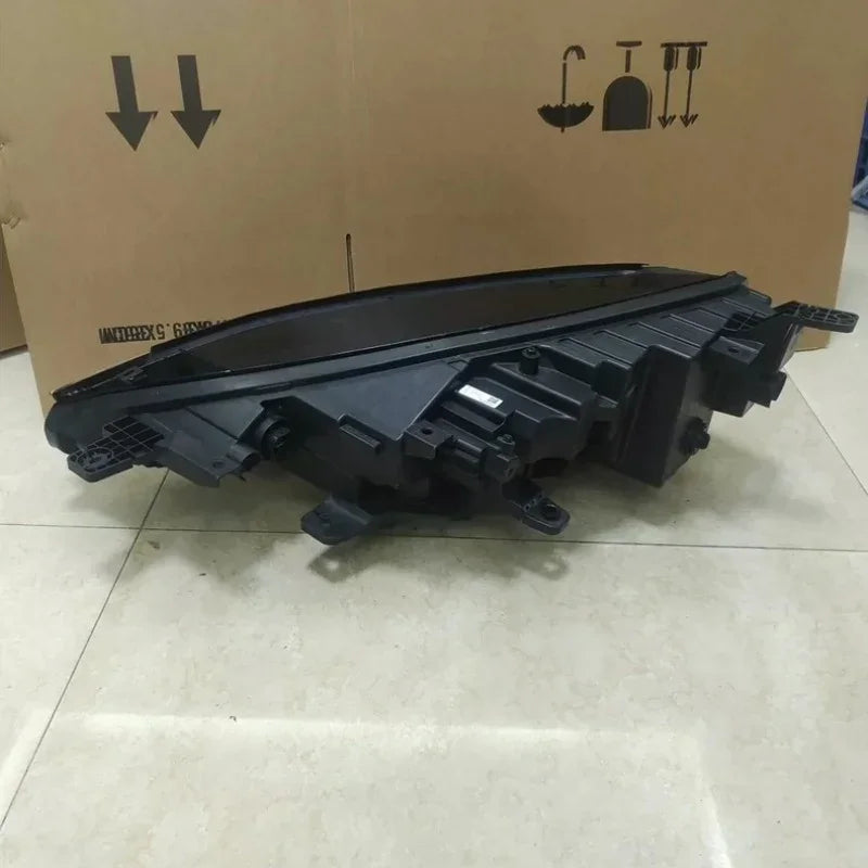 Durable black matte plastic automotive headlight housing component for BYD models.