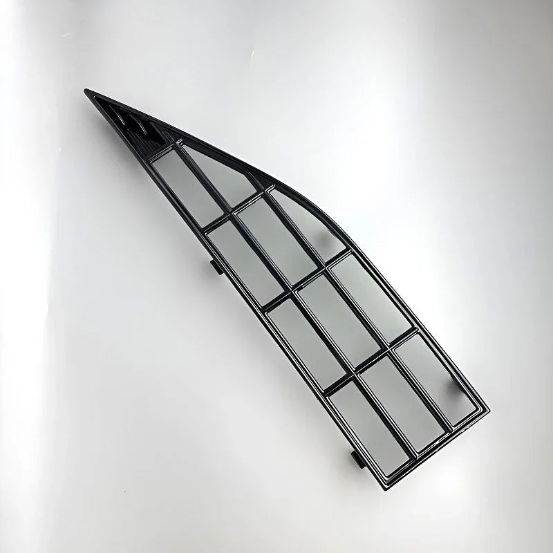 Black matte plastic car window trim grille with a durable grid design.