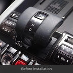 Worn black leather gear shift knob for BYD before installing a protective cover.