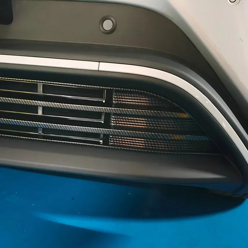 Carbon fiber texture bumper trim accessory in black and silver for BYD models.