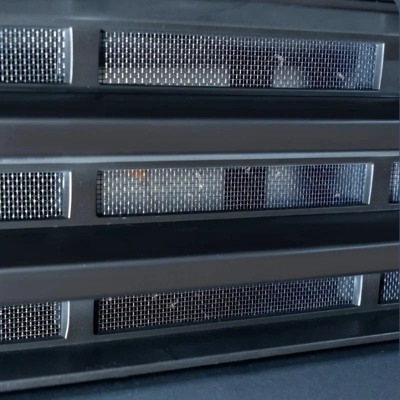 Black matte textured protective grille with fine metallic mesh inserts for BYD accessories.