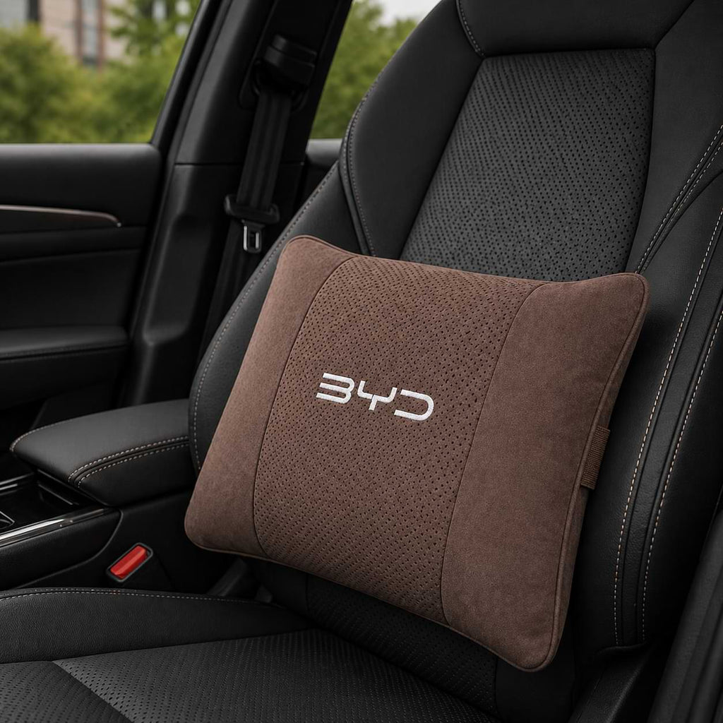 Brown car pillow with BYD logo on a car seat