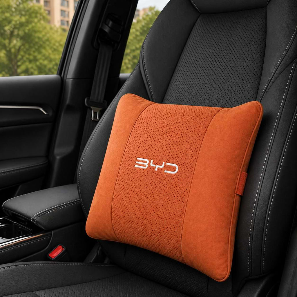 Orange BYD car pillow on a black car seat Waist_pillow