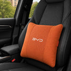 Orange BYD car pillow on a black car seat Waist_pillow