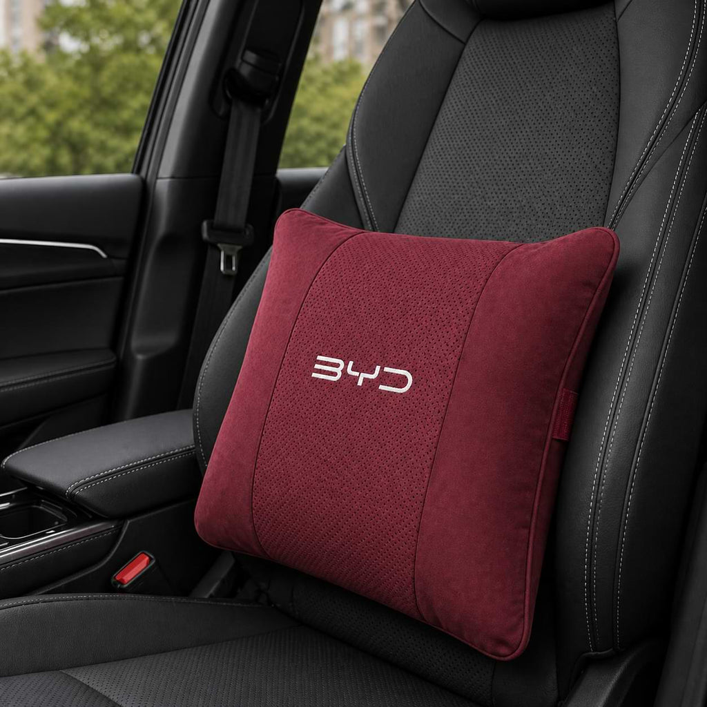 Red pillow with 'BYD' logo on a car seat
