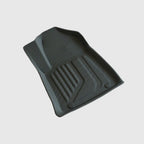Custom-fit black TPE car floor mat with anti-slip texture and raised protective edges.