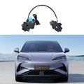Automotive electrical components including a black motor assembly with wiring and a black sensor module.