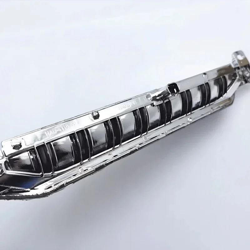 Polished chrome silver car grille trim accessory with a high-gloss metallic finish.