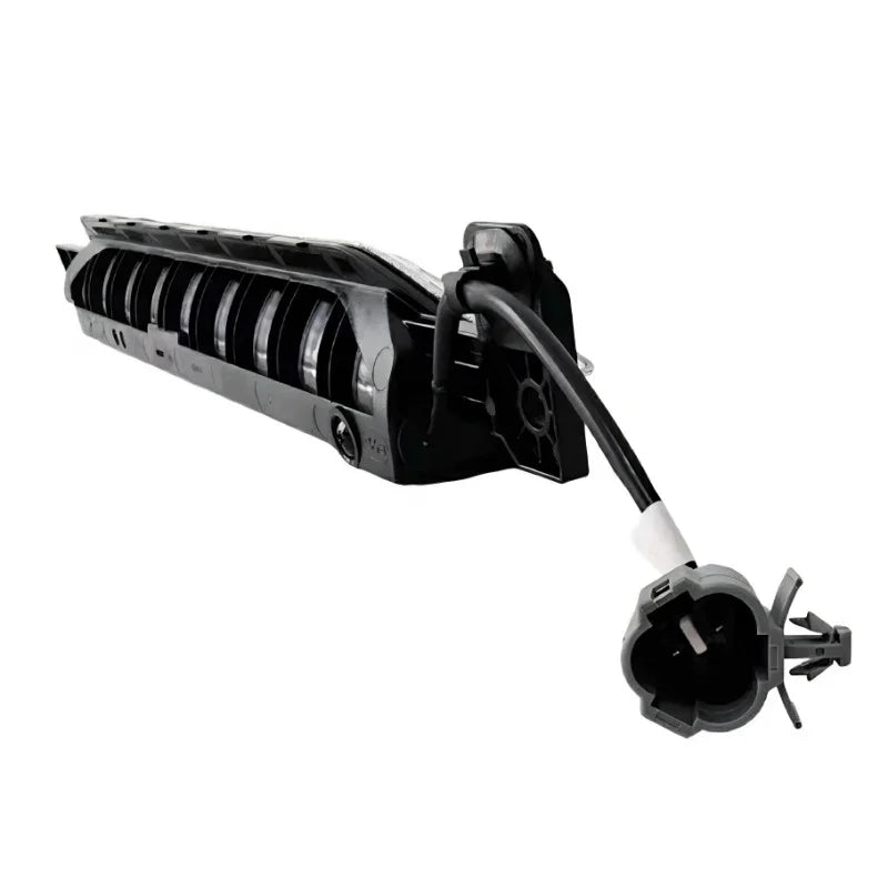 Black durable plastic automotive headlight housing component with electrical connector.