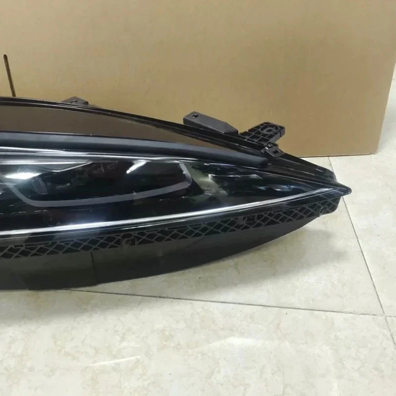 Sleek black aftermarket headlight assembly for BYD vehicles, featuring a durable, high-gloss finish.