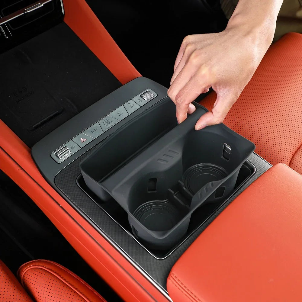 Matte black silicone center console organizer insert for BYD car interior with red leather accents
