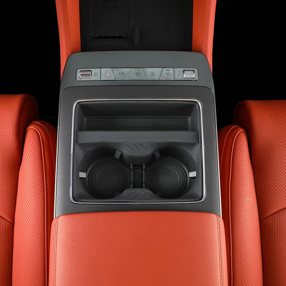 Orange leather center console with dual cup holders and control panel for BYD interior.