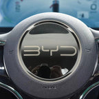 Steering wheel with BYD logo in a car interior