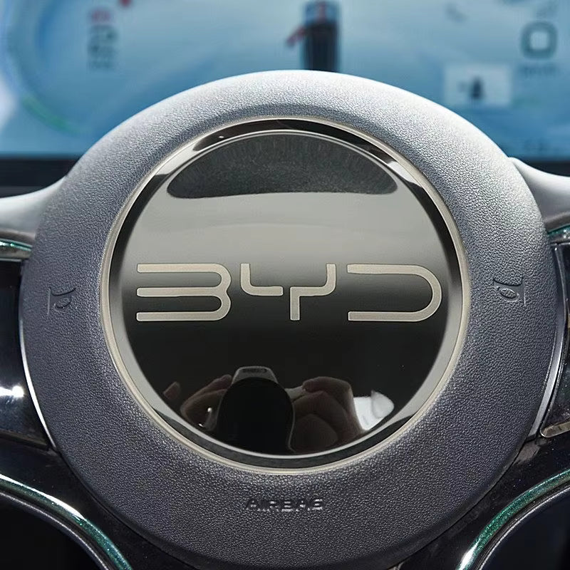 Steering wheel with BYD logo in a car interior
