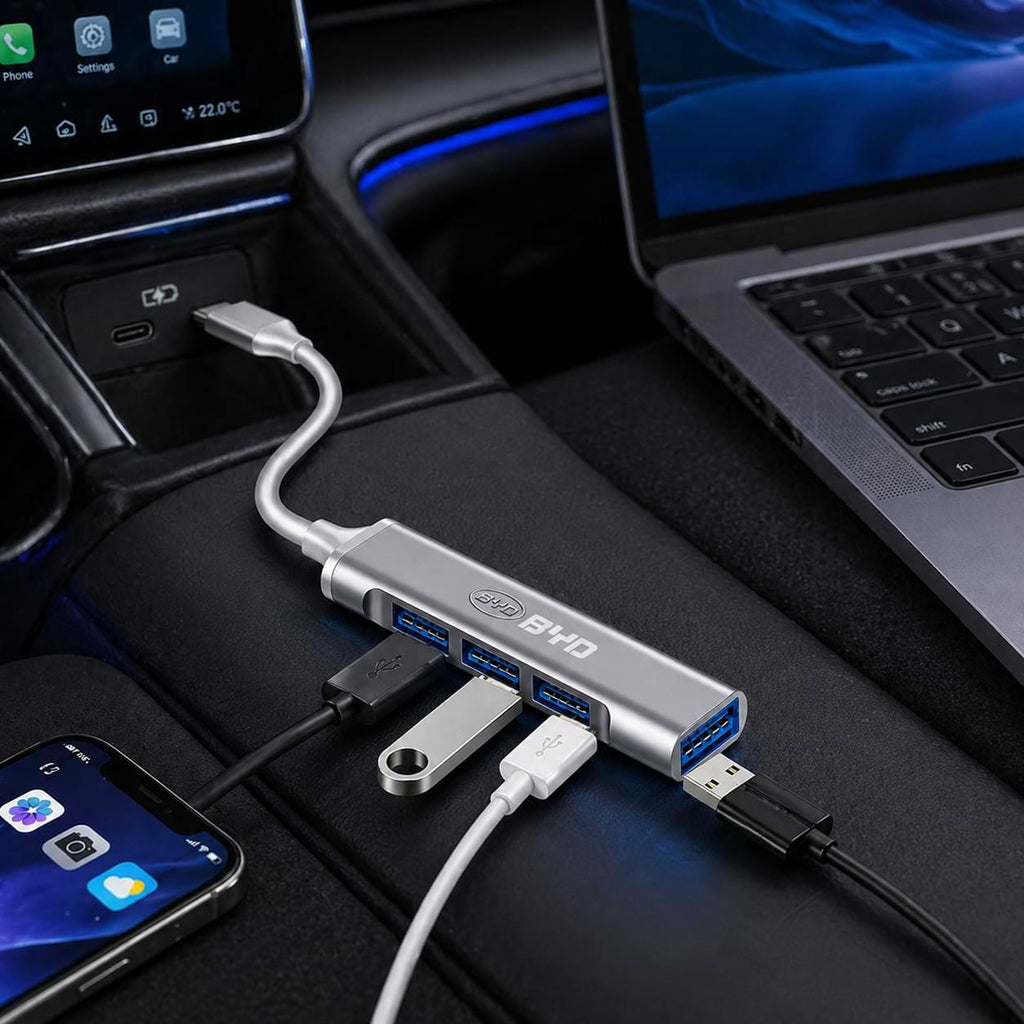 byd USB hub connected to a laptop and smartphone inside a car.