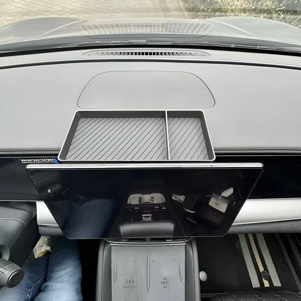 Black textured non-slip dashboard storage tray for BYD car interior protection.