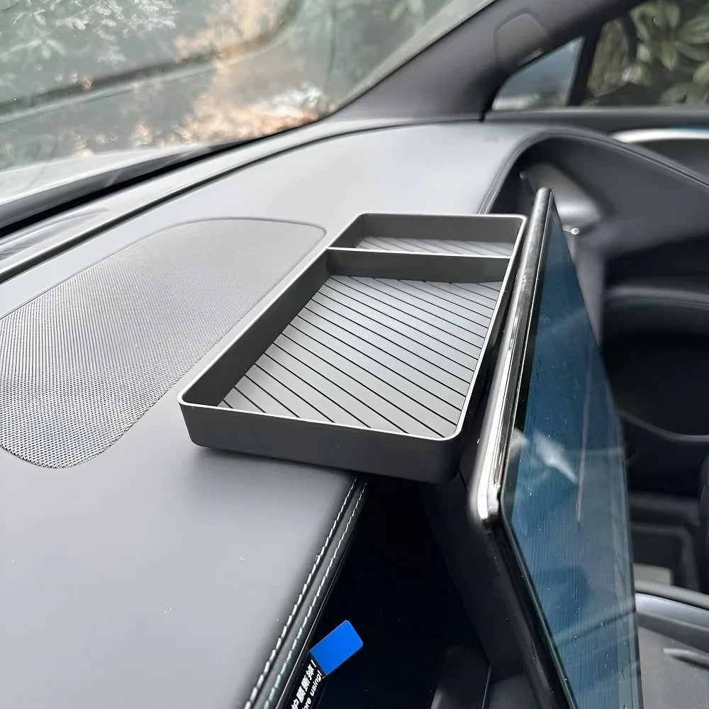 Matte black anti-slip dashboard tray organizer for BYD car interior.