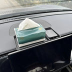 Green soft tissue box holder installed on a car dashboard for convenient access.