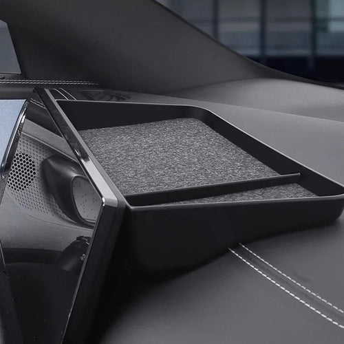 Black matte storage tray with grey anti-slip lining for BYD car interior.