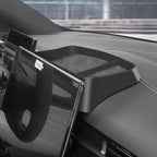 Black matte plastic dashboard storage tray with non-slip lining for BYD car interior.