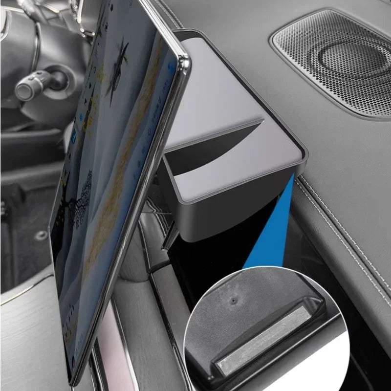Black durable plastic tablet holder mounted in car center console for secure hands-free viewing.