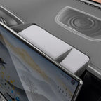 White foam padding inserted into a grey car interior storage compartment near the dashboard.