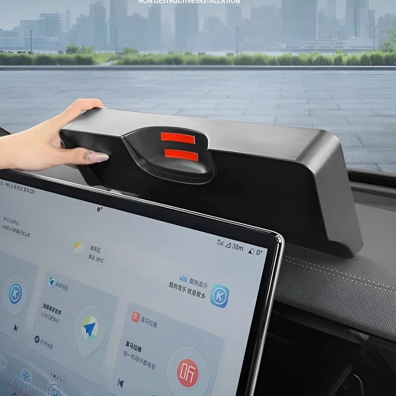 Black matte dashboard storage organizer box installed above the car infotainment screen.