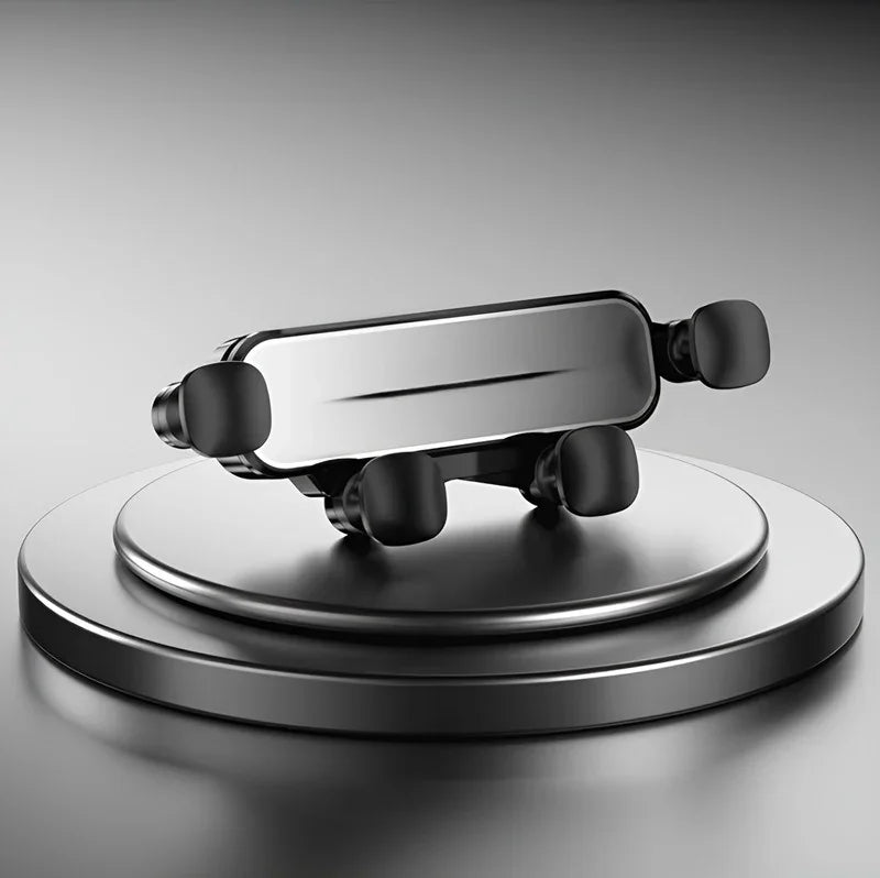 Sleek black and silver metallic car accessory displayed on a circular pedestal against a grey background.