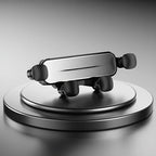 Sleek black and silver metallic car accessory displayed on a circular pedestal against a grey background.